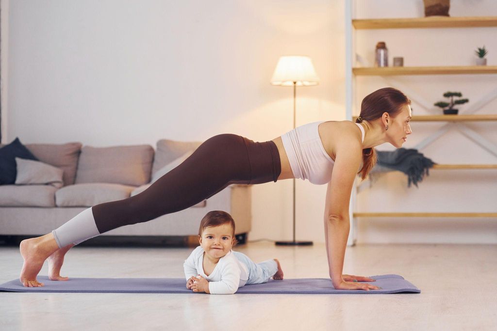 A mother participating in gentle postpartum fitness exercises, supporting her body’s recovery after childbirth.