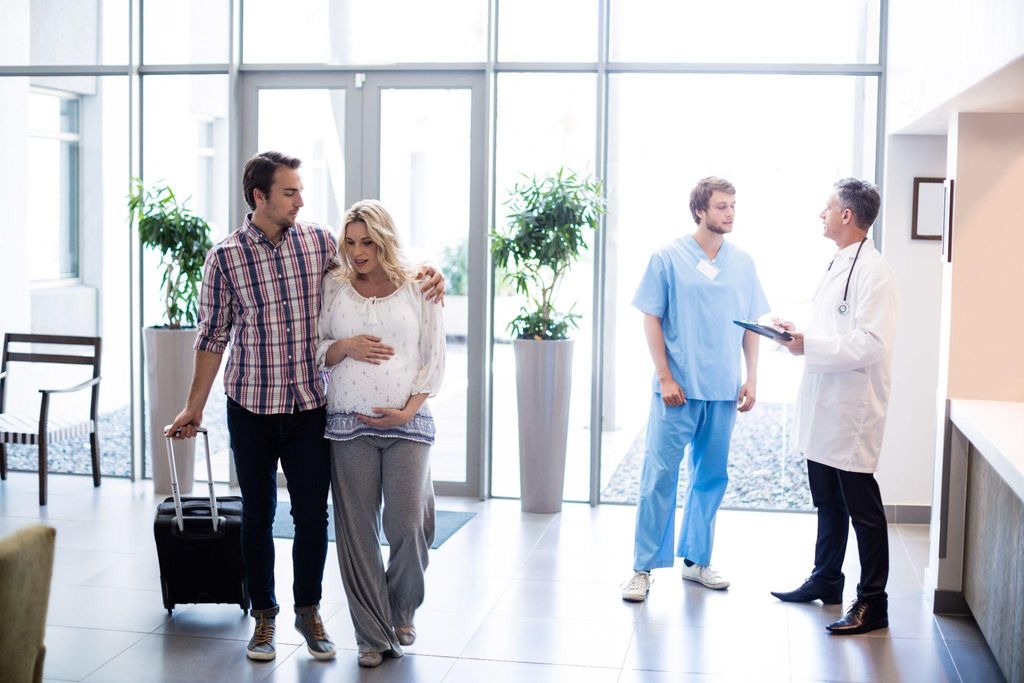 Expectant couple preparing to go to the hospital as labour begins.