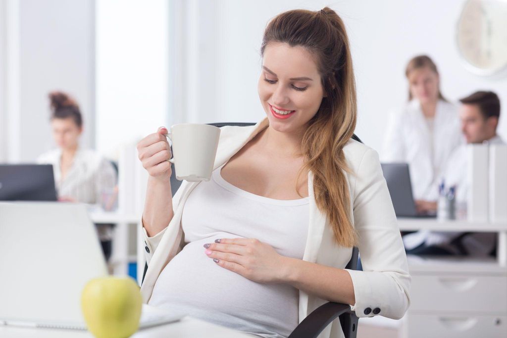 A mum-to-be balancing antenatal care and work responsibilities.