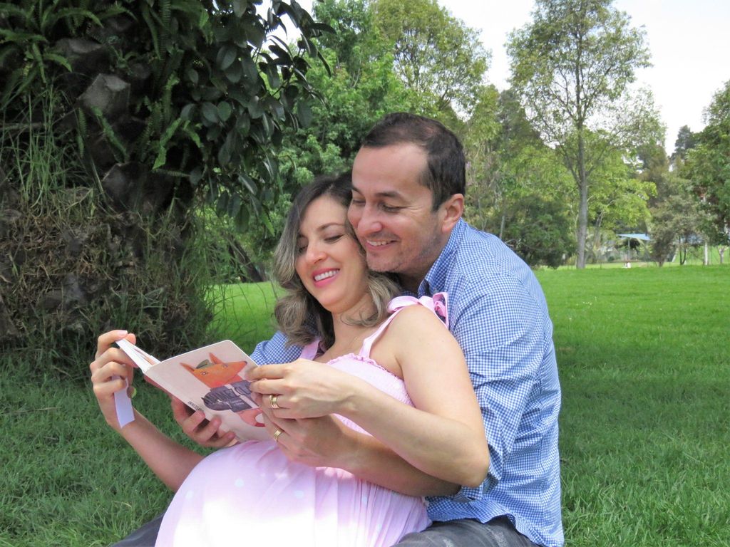 "Expectant mother reading a natural birth book while practising prenatal yoga."